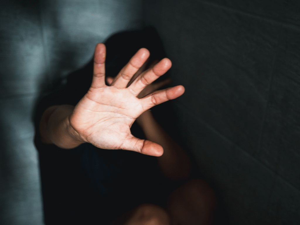 A pleading hand being held out for help.