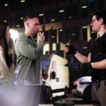 A nighttime DUI stop where a police officer administers a breathalyzer test to a driver during a traffic stop, illustrating how blood alcohol concentration (BAC) is measured and used as evidence in high BAC DUI cases in Sundance, Wyoming.